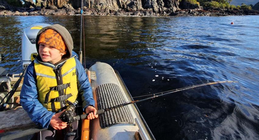 A child with a fishing rod